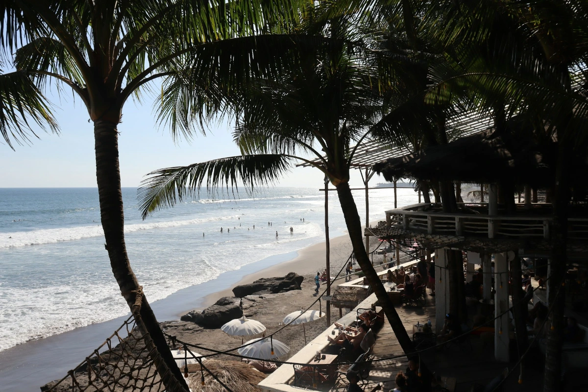 Relax on the beach or try surfing in Canggu and Uluwatu in Bali