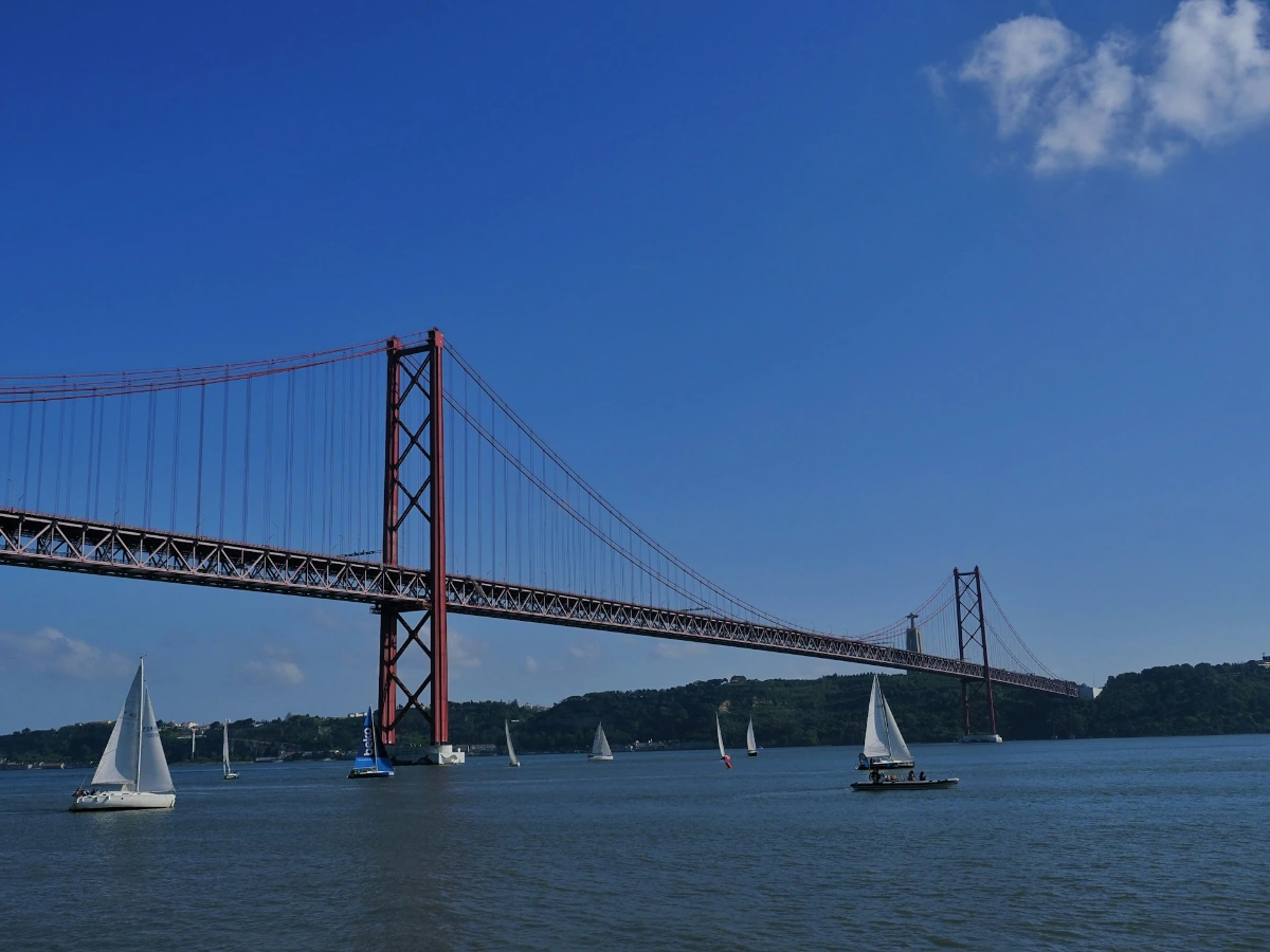 Stroll the Tagus riverside and admire the 25 de Abril Bridge in Lisbon