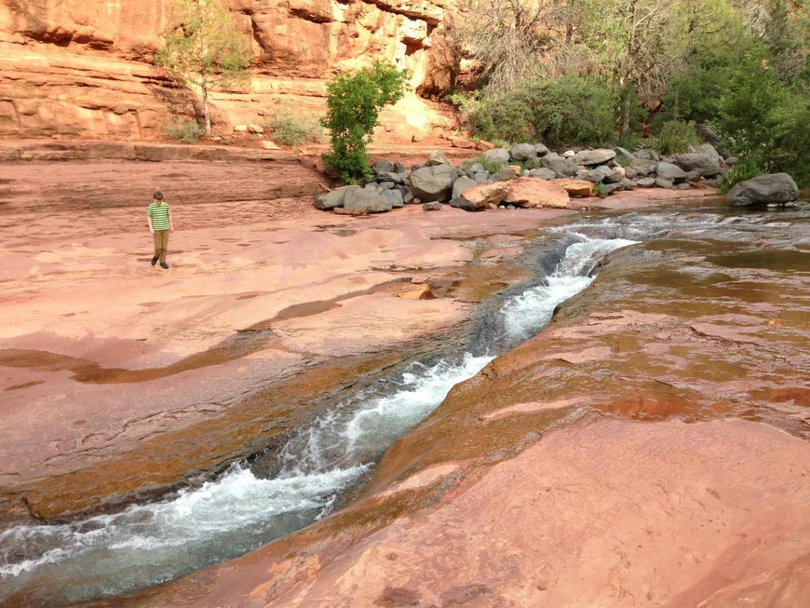 Slide down the natural water slides at Slide Rock State Park in Sedona